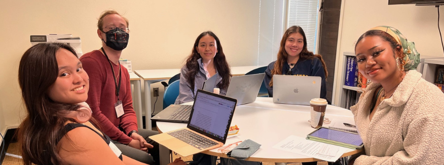 2 of 5, students sitting around table