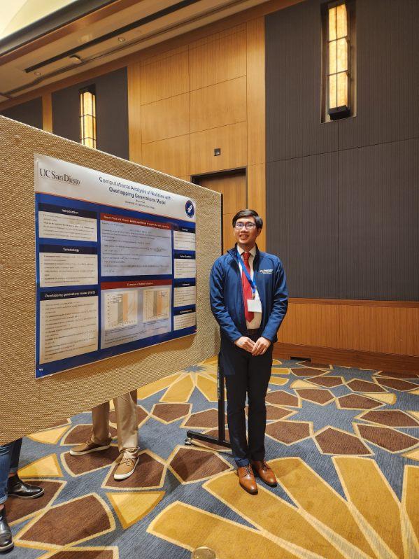 student in front of poster presentation